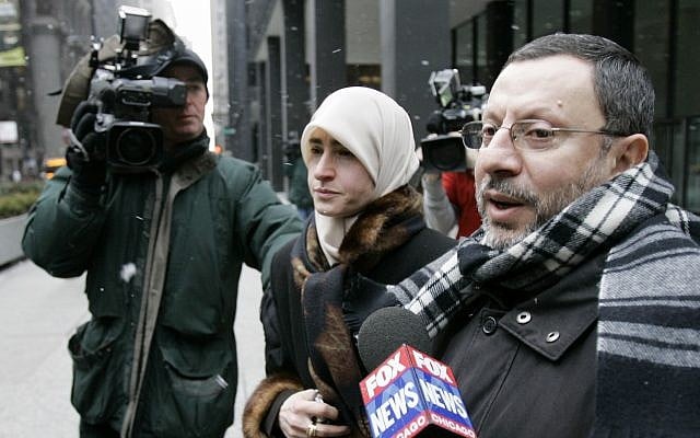 In this photo from February 1, 2007, Abdelhaleem Ashqar is surrounded by cameramen as he leaves federal court with his wife, in Chicago. (AP Photo/Charles Rex Arbogast) In this photo from February 1, 2007, Abdelhaleem Ashqar is surrounded by cameramen as he leaves federal court with his wife, in Chicago. (AP Photo/Charles Rex Arbogast)