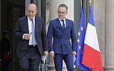 French Foreign Minister Jean-Yves Le Drian, left, and his German counterpart Heiko Maas arrive for a media conference after the cabinet meeting at the Elysee Palace in Paris, France, June 19, 2019. (AP Photo/Michel Euler)