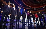 From left, New York City Mayor Bill de Blasio, Rep. Tim Ryan, D-Ohio, former Housing and Urban Development Secretary Julian Castro, Sen. Cory Booker, D-N.J., Sen. Elizabeth Warren, D-Mass., former Texas Rep. Beto O’Rourke, Sen. Amy Klobuchar, D-Minn., Rep. Tulsi Gabbard, D-Hawaii, Washington Gov. Jay Inslee, and former Maryland Rep. John Delaney pose for a photo on stage before the start of a Democratic primary debate hosted by NBC News at the Adrienne Arsht Center for the Performing Arts, Wednesday, June 26, 2019, in Miami. (AP Photo/Brynn Anderson)