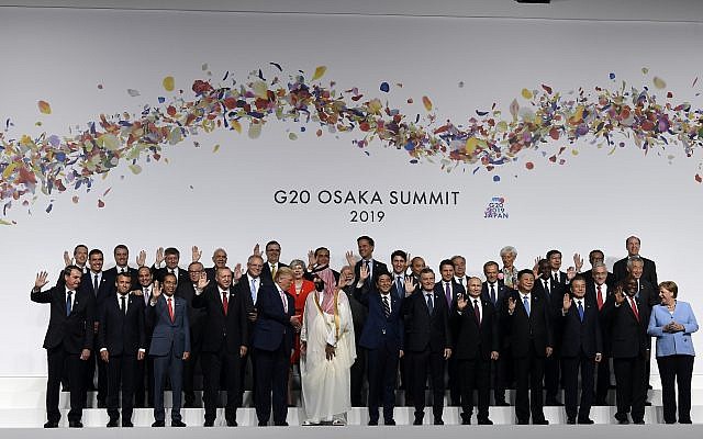 US President Donald Trump shakes hands with Saudi Arabia’s Crown Prince Mohammed bin Salman as they and other leaders gather for a group photo at the G20 summit in Osaka, Japan, June 28, 2019. (AP Photo/Susan Walsh) US President Donald Trump shakes hands with Saudi Arabia’s Crown Prince Mohammed bin Salman as they and other leaders gather for a group photo at the G20 summit in Osaka, Japan, June 28, 2019. (AP Photo/Susan Walsh)