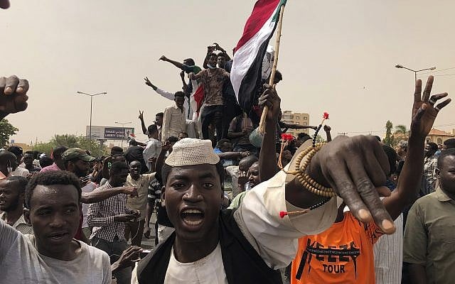 Sudanese protesters march during a demonstration against the military council, in Khartoum, Sudan, on June 30, 2019. (AP Photo/Hussein Malla) Sudanese protesters march during a demonstration against the military council, in Khartoum, Sudan, on June 30, 2019. (AP Photo/Hussein Malla)