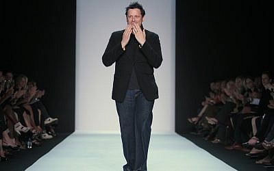 Fashion designer Isaac Mizrahi reacts to applause after presenting his Spring 2011 collection, Thursday, September 16, 2010, during Fashion Week in New York. (AP Photo/Bebeto Matthews)