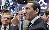 Altice founder Patrick Drahi, right, waits with company executives for the Altice IPO to begin trading, on the floor of the New York Stock Exchange, Thursday, June 22, 2017. (AP Photo/Richard Drew)