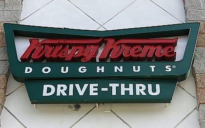 This photo from August 11, 2017, shows a Krispy Kreme Doughnuts sign in Miami. (AP Photo/Alan Diaz)