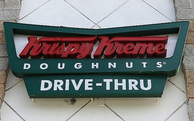 This photo from August 11, 2017, shows a Krispy Kreme Doughnuts sign in Miami. (AP Photo/Alan Diaz)