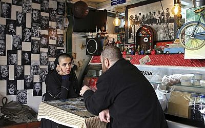 Illustrative: Two young Iranians sit in a fast food restaurant in downtown Tehran, Iran, January 3, 2018. (AP Photo/Ebrahim Noroozi)