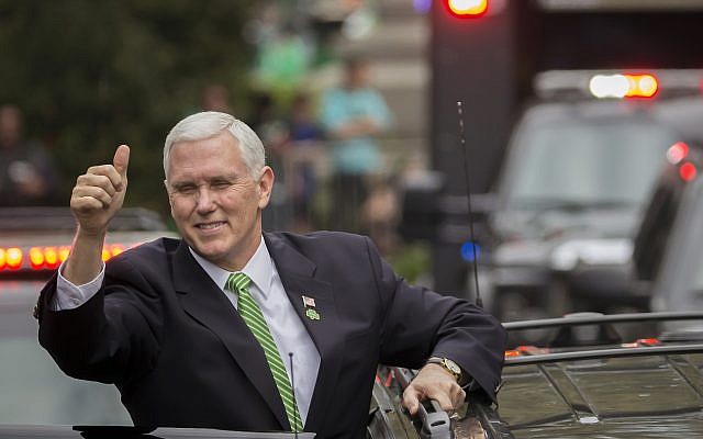 Vice President Mike Pence gives the crowd a thumbs-up before climbing into his motorcade at the Savannah St. Patrick's Day parade, March 17, 2018, in Savannah, Georgia. (AP Photo/Stephen B. Morton) Vice President Mike Pence gives the crowd a thumbs-up before climbing into his motorcade at the Savannah St. Patrick's Day parade, March 17, 2018, in Savannah, Georgia. (AP Photo/Stephen B. Morton)
