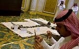 Illustrative: Reporters film the scene during a media presentation of what Saudi officials say is the wreckage of Iranian-Houthi suicide drones, in Khobar city, Saudi Arabia, April 16, 2018. (AP Photo/Amr Nabil)