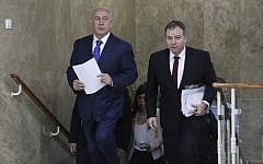 Prime Minister Benjamin Netanyahu, left, and Prime Minister's Office Director-General Yoav Horowitz, right, arrive for the weekly cabinet meeting at the Prime Minister's Office in Jerusalem, December 16, 2018. (Abir Sultan/Pool Photo via AP)