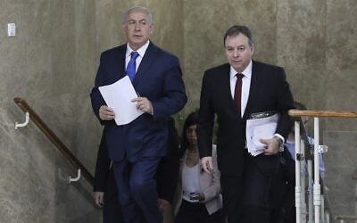 Prime Minister Benjamin Netanyahu, left, and his chief of staff at the time, Yoav Horowitz, arrive for a weekly cabinet meeting at the Prime Minister's Office in Jerusalem, December 16, 2018. (Abir Sultan/Pool via AP) Prime Minister Benjamin Netanyahu, left, and his chief of staff at the time, Yoav Horowitz, arrive for a weekly cabinet meeting at the Prime Minister's Office in Jerusalem, December 16, 2018. (Abir Sultan/Pool via AP)