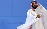 In this November 30, 2018 file photograph, Saudi Arabia's Crown Prince Mohammed bin Salman adjusts his robe as leaders gather for the group at the G20 Leader's Summit at the Costa Salguero Center in Buenos Aires, Argentina. (AP Photo/Ricardo Mazalan, File)