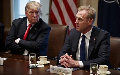 US President Donald Trump listens as acting Defense Secretary Patrick Shanahan speaks during an expanded bilateral meeting with NATO Secretary General Jens Stoltenberg in the Cabinet Room of the White House, April 2, 2019, in Washington. (AP Photo/Evan Vucci)