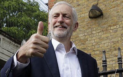 Jeremy Corbyn leader of Britain's opposition Labour Party gives the thumbs up after voting in the European Elections in London, Thursday, May 23, 2019. (AP Photo/Kirsty Wigglesworth)