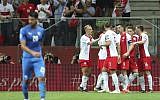 Poland's Krzysztof Piatek celebrates with teammates after scoring his side's opening goal during the Euro 2020 group G qualifying soccer match between Poland and Israel at the Narodowy stadium in Warsaw, Poland, June 10, 2019. (AP Photo/Czarek Sokolowski)