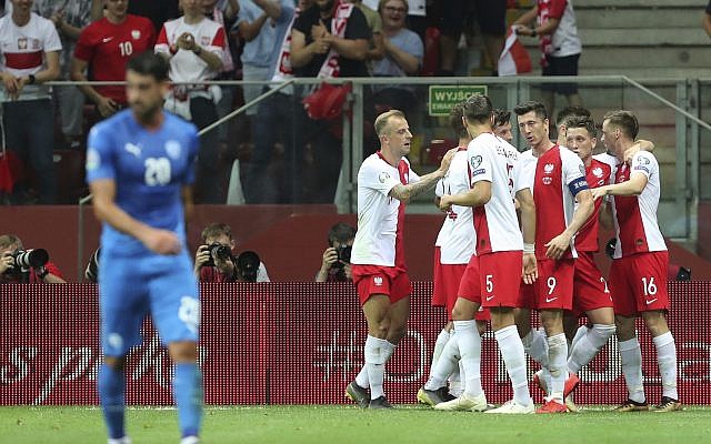Poland's Krzysztof Piatek celebrates with teammates after scoring his side's opening goal during the Euro 2020 group G qualifying soccer match between Poland and Israel at the Narodowy stadium in Warsaw, Poland, June 10, 2019. (AP Photo/Czarek Sokolowski) Poland's Krzysztof Piatek celebrates with teammates after scoring his side's opening goal during the Euro 2020 group G qualifying soccer match between Poland and Israel at the Narodowy stadium in Warsaw, Poland, June 10, 2019. (AP Photo/Czarek Sokolowski)