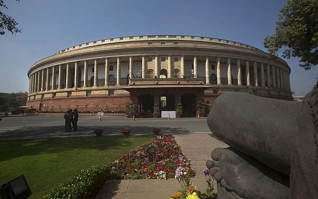 The Indian parliament building is seen from behind a Mahatma Gandhi statue, right, in New Delhi, India, February 23, 2016. (Manish Swarup/AP) The Indian parliament building is seen from behind a Mahatma Gandhi statue, right, in New Delhi, India, February 23, 2016. (Manish Swarup/AP)
