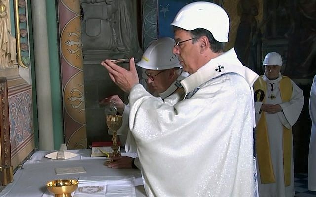 Michel Aupetit, Archbishop of Paris, celebrates the first Mass being celebrated in a side chapel, two months after a devastating fire engulfed the Notre-Dame de Paris cathedral, Saturday June 15, 2019, in Paris (KTO via AP) Michel Aupetit, Archbishop of Paris, celebrates the first Mass being celebrated in a side chapel, two months after a devastating fire engulfed the Notre-Dame de Paris cathedral, Saturday June 15, 2019, in Paris (KTO via AP)