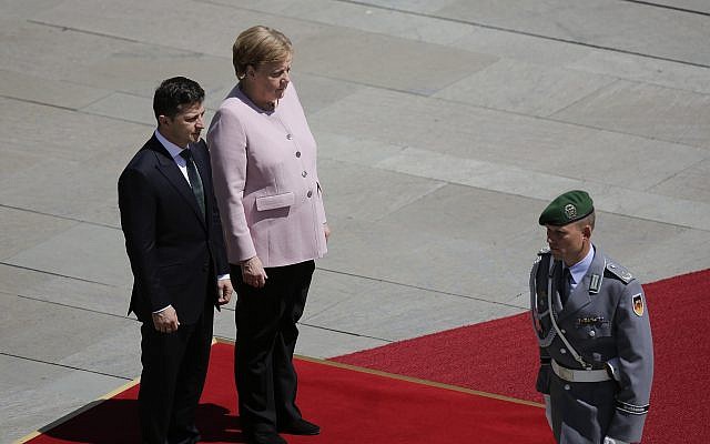Ukrainian President Volodymyr Zelensky walks on the red carpet during a welcoming ceremony by German Chancellor Angela Merkel prior to a meeting at the chancellery in Berlin, Germany, June 18, 2019. (AP Photo/Markus Schreiber) Ukrainian President Volodymyr Zelensky walks on the red carpet during a welcoming ceremony by German Chancellor Angela Merkel prior to a meeting at the chancellery in Berlin, Germany, June 18, 2019. (AP Photo/Markus Schreiber)