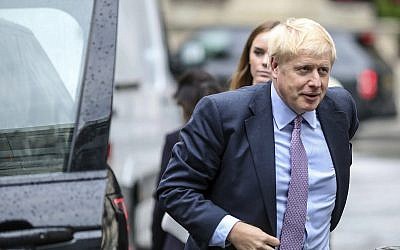 British Conservative party leadership contender Boris Johnson arrives for a live TV debate in central London Tuesday, June 18, 2019. (AP Photo/Vudi Xhymshiti)