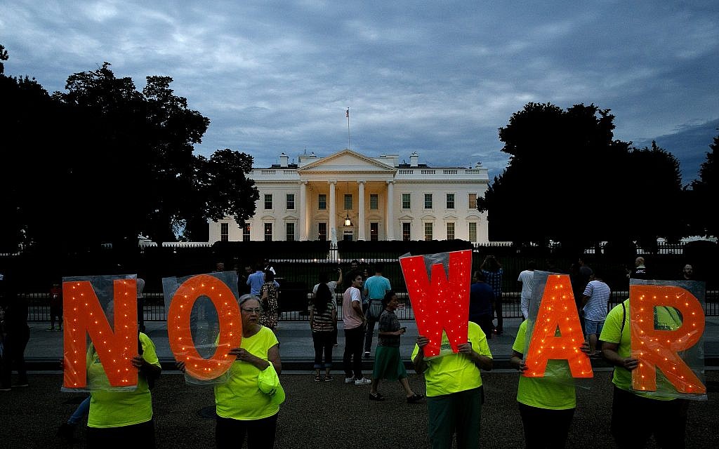 Protesters hold signs spelling out, "No War," outside the White House, Thursday June 20, 2019, in Washington, after President Donald Trump tweeted that "Iran made a very big mistake" by shooting down a U.S. surveillance drone over the Strait of Hormuz in Iran. (AP/Jacquelyn Martin) Protesters hold signs spelling out, "No War," outside the White House, Thursday June 20, 2019, in Washington, after President Donald Trump tweeted that "Iran made a very big mistake" by shooting down a U.S. surveillance drone over the Strait of Hormuz in Iran. (AP/Jacquelyn Martin)