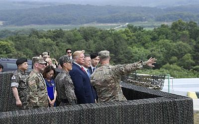 US President Donald Trump views North Korea from the Korean Demilitarized Zone from Observation Post Ouellette at Camp Bonifas in South Korea, June 30, 2019. (AP Photo/Susan Walsh)