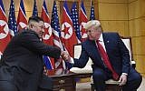US President Donald Trump (right) meets with North Korean leader Kim Jong Un at the border village of Panmunjom in the Demilitarized Zone, South Korea, June 30, 2019. (AP Photo/Susan Walsh)