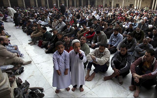 Illustrative - Muslims attend the Friday noon prayer at Al-Azhar mosque in Cairo, Egypt, December 28, 2012. (AP/Khalil Hamra) Illustrative - Muslims attend the Friday noon prayer at Al-Azhar mosque in Cairo, Egypt, December 28, 2012. (AP/Khalil Hamra)