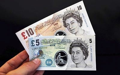 Illustrative photo of British banknotes during a news conference at the Bank of England in London, September 10, 2013. (Chris Ratcliffe/AP)