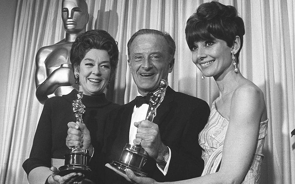 Audrey Hepburn, right, shown with Fred Zinneman and Rosalind Russell, left, in this April 10, 1967 photo taken at the 1967 Academy Award presentations. (AP Photo/ File)