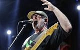 Efraim Shamir of the Israeli rock band Kaveret performs during the group's comeback tour in the summer of 2013. (Moshe Shai/Flash90)