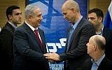 Prime Minister Benjamin Netanyahu (L) seen with MK Amir Ohana at a Likud party meeting in the Knesset on January 11, 2016. (Miriam Alster/Flash90)