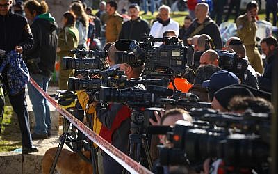 Illustrative: Israeli and foreign media at the scene of a Jerusalem terror attack on January 8, 2017. (Shlomi Cohen/Flash90)