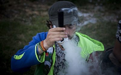 Israelis gather at the Rose Garden in front of the Knesset to mark the international '4:20' marijuana smoking day, in a demonstration to push legalizing the drug, in Jerusalem, on April 20, 2017. (Yonatan Sindel/Flash90)