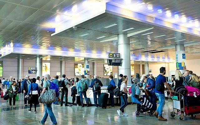 Illustrative: Travelers in the arrival hall of Ben Gurion Airport, near Tel Aviv, on April 11, 2018. (Moshe Shai/FLASH90) Illustrative: Travelers in the arrival hall of Ben Gurion Airport, near Tel Aviv, on April 11, 2018. (Moshe Shai/FLASH90)