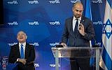 Justice Minister Amir Ohana entertains Prime Minister Benjamin Netanyahu at a Likud gathering. (Hadas Porush/Flash90)
