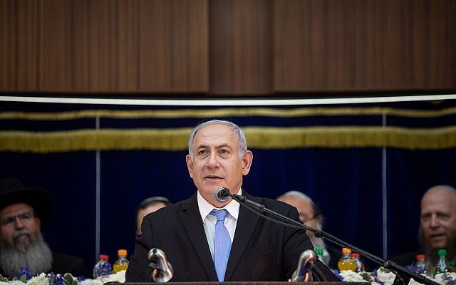 Prime Minister Benjamin Netanyahu speaks during Jerusalem Day celebrations at the Mercaz HaRav Yeshiva in Jerusalem, on June 2, 2019. ( Aharon Krohn/Flash90) Prime Minister Benjamin Netanyahu speaks during Jerusalem Day celebrations at the Mercaz HaRav Yeshiva in Jerusalem, on June 2, 2019. ( Aharon Krohn/Flash90)
