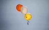 Illustrative: A balloon carrying an incendiary device is flown out of the Gaza Strip on May 31, 2019 (Hassan Jedi/Flash90)