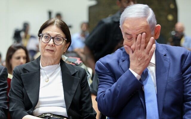 Then-prime minister Benjamin Netanyahu (right) and Supreme Court president Esther Hayut at a ceremony at the President's Residence in Jerusalem on June 17, 2019. (Noam Revkin Fenton/Flash90) Then-prime minister Benjamin Netanyahu (right) and Supreme Court president Esther Hayut at a ceremony at the President's Residence in Jerusalem on June 17, 2019. (Noam Revkin Fenton/Flash90)