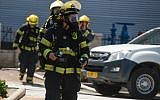 Firefighters at the scene of ammonia leak, near a shopping mall in Acre, June 27, 2019. (Meir Vaknin/Flash90)