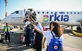 Passengers boarding what appears to be one of the final Arkia Airlines flights to Eilat at the Sde Dov Airport in Tel Aviv on June 30, 2019. (Flash90)