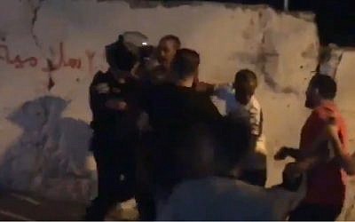 Screen capture from video allegedly showing a Palestinian man who was shot by Israeli Police after launching fireworks at them in the Issawiya neighborhood of East Jerusalem, June 27, 2019. (Twitter)