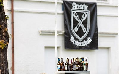 Empty beer bottles stand in front of the hotel where the Shield and Sword festival took place in Ostritz, Germany, June 22, 2019. (Daniel Schäfer/picture alliance/ Getty Images via JTA)