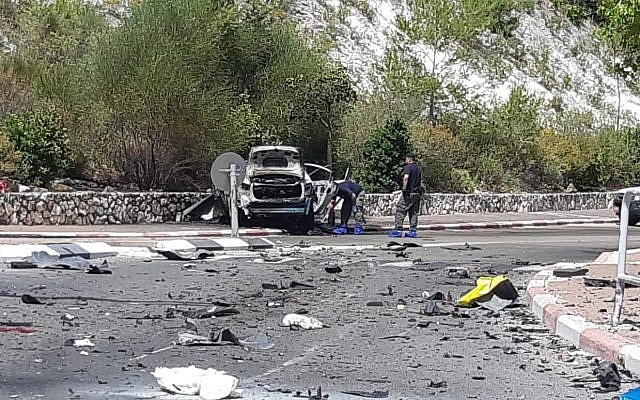 The scene of a car explosion in a suspected underworld hit in Nesher, June 3, 2019. (Israel Police) The scene of a car explosion in a suspected underworld hit in Nesher, June 3, 2019. (Israel Police)