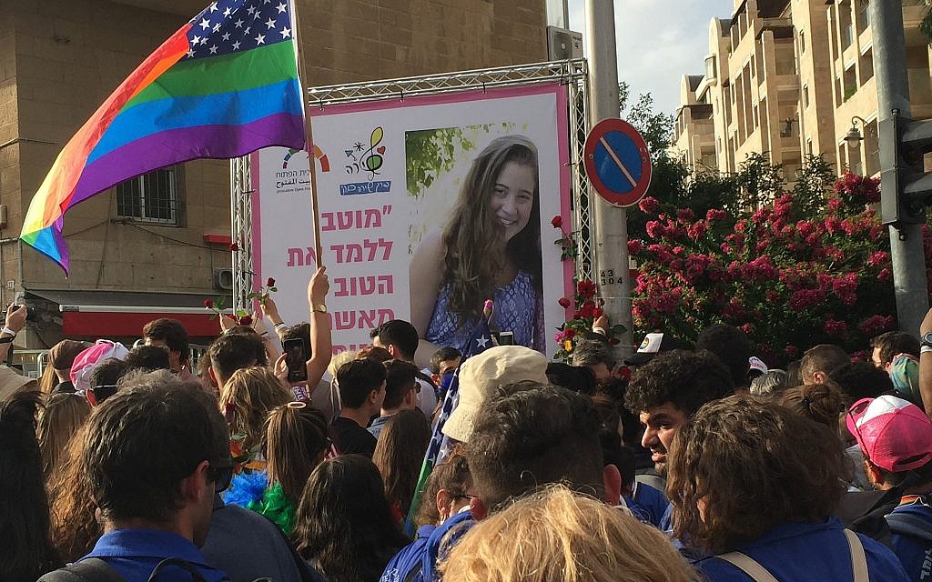 Participants in the annual Jerusalem Gay Pride parade place flowers at a memorial for Shira Banki, who was murdered during the parade in 2015, on June 6, 2019. (Times of Israel) Participants in the annual Jerusalem Gay Pride parade place flowers at a memorial for Shira Banki, who was murdered during the parade in 2015, on June 6, 2019. (Times of Israel)