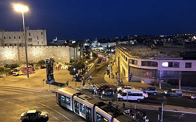 As darkness falls, a view from a balcony at the scene unfolding in 'View Field,' a new Clipa Theater performance at the 2019 Israel Festival (Jessica Steinberg/Times of Israel)