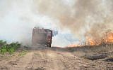 Fire teams battle a blaze caused by arson balloons launched from Gaza into Israel on June 14, 2019 (Fire Services and Rescue)