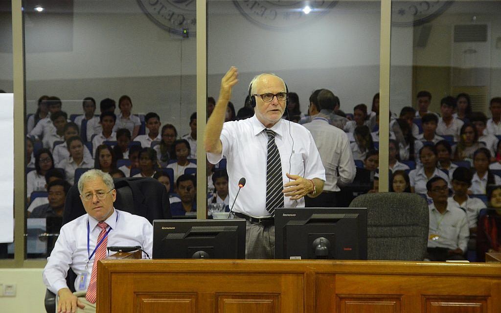 Martin Karopkin, front right, speaks at the Khmer Rouge war crimes tribunal, while American attorney Phil Weiner, left, listens. (Courtesy)