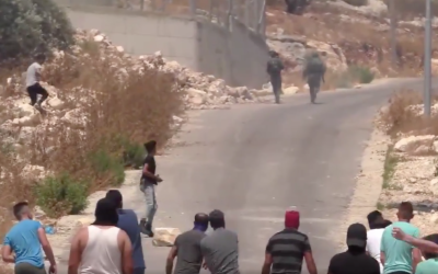 IDF soldiers flee from a group of Palestinian stone throwers on June 22, 2019. (Screen capture/Twitter)