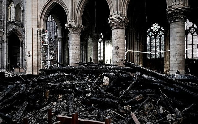 A worker stands on scaffolding during preliminary restoration work inside the Notre Dame Cathedral, May 15, 2019. (Philippe Lopez/Pool via AP) A worker stands on scaffolding during preliminary restoration work inside the Notre Dame Cathedral, May 15, 2019. (Philippe Lopez/Pool via AP)