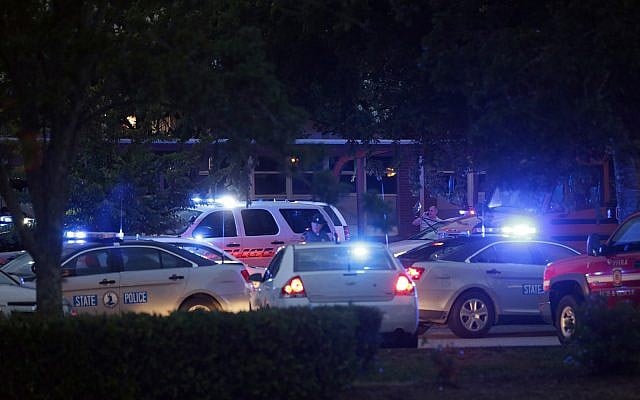 Emergency vehicles fill the parking lot at the Princess Anne Middle School in Virginia Beach, Virginia, after a nearby shooting killed 12, May 31, 2019. (AP Photo/Vicki Cronis-Nohe) Emergency vehicles fill the parking lot at the Princess Anne Middle School in Virginia Beach, Virginia, after a nearby shooting killed 12, May 31, 2019. (AP Photo/Vicki Cronis-Nohe)